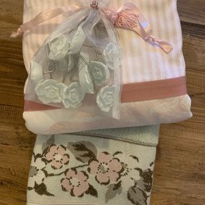 Shower curtain, hooks, and decorative towel.